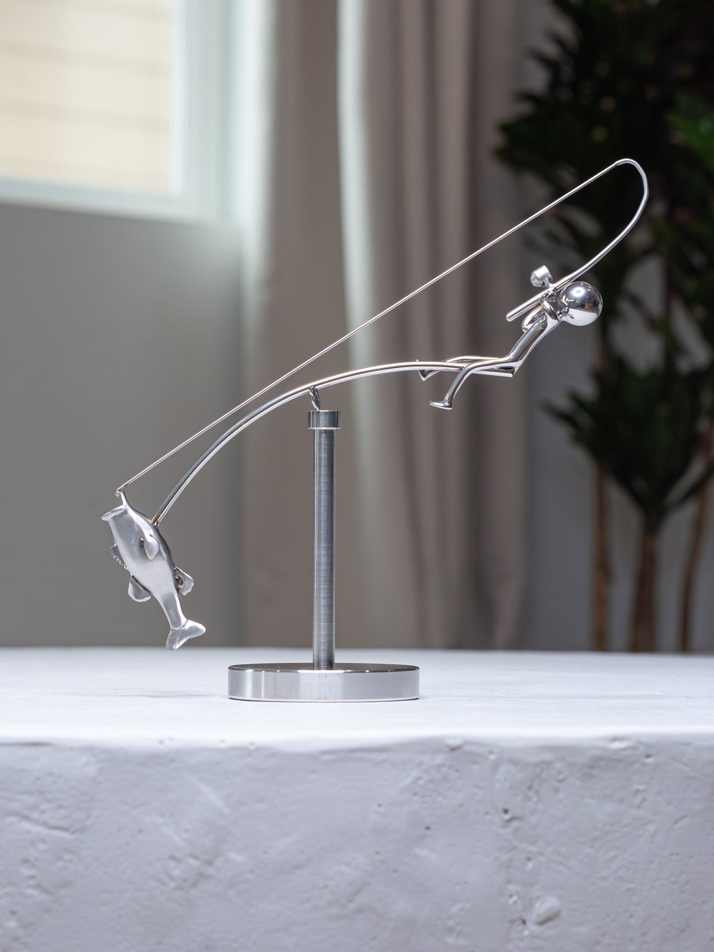 🎣Fiskeren, der balancerer skulpturen