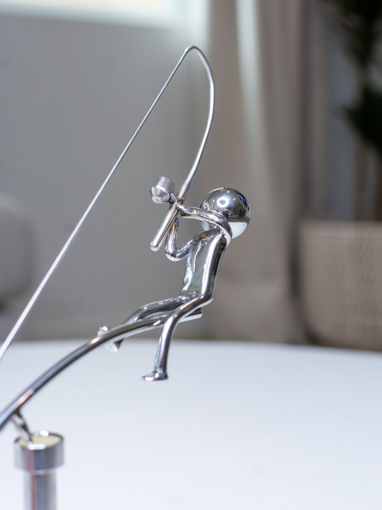 🎣Fiskeren, der balancerer skulpturen